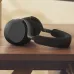 Desk view of Jabra Evolve3 85 MS LINK390A Wireless Headphone showing folded design placed on wooden surface