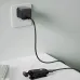 Lifestyle view of XO BE51 Clip On Headphone charging from a wall adapter via USB cable.