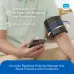 Person using Omron Smart Elite+ HEM‑7600T Arm BP Monitor with IntelliWrap cuff and smartphone for accurate readings.