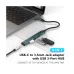 Angled top view of the Onten OTN-9706 4-in-1 Type-C to USB 3.0 Hub with 3.5mm Jack connected to a laptop showing compact design.