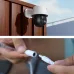 Outdoor view of Meari S7 Plus PTZ WiFi Camera on wooden wall with close-up of power connector setup.