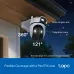 Mounted view of TP-Link Tapo C545D WiFi Camera under eaves highlighting wide-angle and telephoto pan/tilt lens coverage.