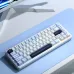 Angled top view of the AULA F65 Hot Swappable Reaper Switch Tri‑Mode Mechanical Gaming Keyboard showing compact layout and keycaps.