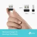 Handheld view of TP-Link Archer TX1U Nano AX300 USB Wi-Fi 6 Adapter comparing ultra-small size against fingers for portability
