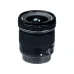 Angled perspective view of compact Canon EF-S 10-18mm f/4.5-5.6 IS STM ultra-wide zoom lens standing vertically