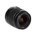 Angled view of Canon EF-S 18-55mm f/3.5-5.6 III zoom lens showing front glass element and focal markings