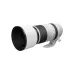 Angled view of white Canon RF 100-500mm f/4.5-7.1 L IS USM lens with attached round lens hood and tripod collar foot