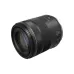 Angled view of compact Canon RF 85mm f/2 Macro IS STM prime lens showing Canon logo, 85 designation, and focus ring