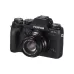 Angled view of Fujifilm Fujinon XF 35mm f/2 R WR prime lens mounted on a black Fujifilm X-T1 mirrorless camera