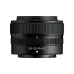 Front profile view of compact retracted Nikon NIKKOR Z 24-50mm f/4-6.3 lens standing vertically showing model text