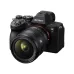 Angled view of Sony FE 24-50mm f/2.8 G zoom lens mounted on a black Sony Alpha 7R camera body