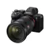 Angled view of Sony FE 24-70mm f/2.8 GM II zoom lens mounted on a black Sony Alpha 7 camera body