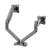Top-down view of a dual-arm monitor desk mount in black, showing the flexible mechanical spring arms and the C-clamp base attachment for desk mounting.