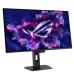 An angled front view of the black ASUS ROG Strix OLED XG27ACDMS monitor on its stand, displaying a purple/pink ROG logo and glowing particles on the screen.