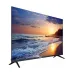 Dahua DHI-LM43-F400N display showcasing a vibrant sunset over the ocean, with dramatic waves and a silhouette of trees.