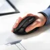 Close-up of hand using Meetion BTM008 Dual Mode Wireless Mouse highlighting grip comfort, side buttons, and sleek matte finish.