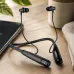 Lifestyle desk view of Unikyy Y10 Magnetic Bluetooth Neckband placed beside laptop showing earbuds and flexible neckband form