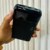 Handheld view of Awei PA-91 10000mAh 22.5W Power Bank with Cable showing compact design and top port section