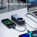 Power bank charging three devices simultaneously via Type-C cables, connected to smartphone, laptop, and tablet on desk setup