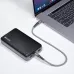 Black Verbatim VAPPP110 power bank connected to a laptop via USB-C cable.
