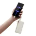 Holding in a hand the Xiaomi PB1067 67W 10000mAh Power Bank with Type-C Cable