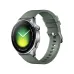 Front view of Xiaomi Watch 5 with round display showing time, heart rate, battery status, and date on green strap design.