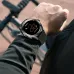 Wrist view of HONOR CHOICE Watch 2 Epic with black band showing outdoor activity tracking screen.