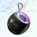 Angled view of the Awei KA19 Bluetooth Speaker splashing in water, showing its round design and glowing multicolor top ring.
