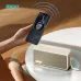 Angled close-up of BWOO BO-BS97 Portable Bluetooth Speaker placed on table while wirelessly charging smartphone in modern setup