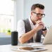 Desk lifestyle view of the Monster S310 Portable Bluetooth Speaker placed beside a laptop during everyday listening use.