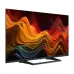 Front three-quarter view of Haier H43S80GUX TV with colorful abstract display, sleek frame, and modern stand