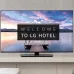 Side profile of LG 55UR761H Hotel TV highlighting slim curved back and rectangular base stand.