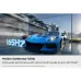 Gaming view of Samsung 65S95H OLED TV highlighting 165Hz refresh rate with motion blur racing car.
