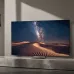 Mounted Samsung 85R95H Micro RGB TV displaying vivid desert landscape under starry night sky.
