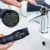 Cleaning view of Panasonic ER-GB42-K Trimmer rinsed under faucet showing waterproof design for easy maintenance.