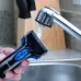 Close-up of Panasonic ES-SA40K Shaver held under faucet with water rinsing foil head for easy cleaning.