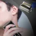 Usage view of Panasonic ES-SA40K Shaver along jawline with inset close-up of foil cutting head.