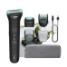 Philips BG7470/15 body groomer kit with precision combs, intimate guard, USB charging cable, and a grey fabric travel pouch.