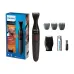 Front view of Philips MG1100/16 1000 Series Trimmer set with main unit, combs, shaver head, battery, and brush.