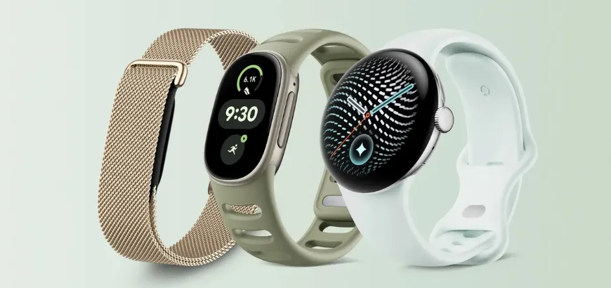 Three Google smartwatches side by side: a gold mesh-band tracker, an olive green sport-band tracker, and a round watch with a light mint band